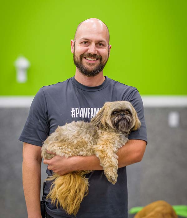 bay-park-employee-holding-a-dog Bay Park employee holding a dog