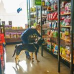 Woman and dog shopping in the retail store