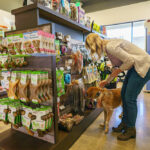 Dog and owner shopping for treats